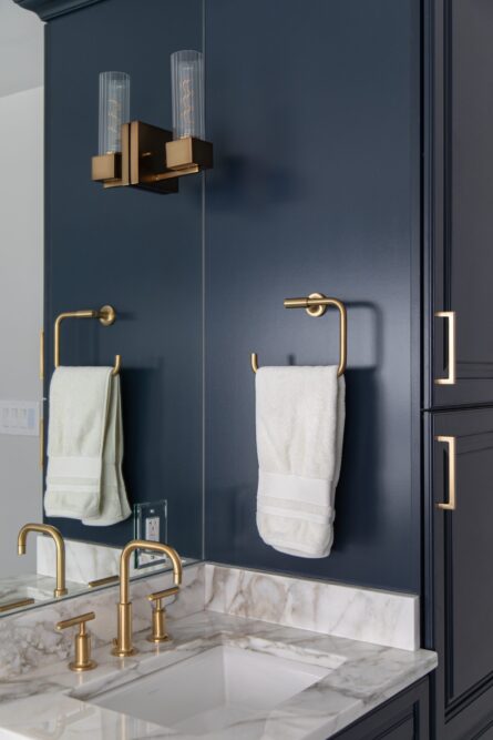 Photo of a bathroom design project with luxury faucets, a fresh color palette and ample storage solutions.