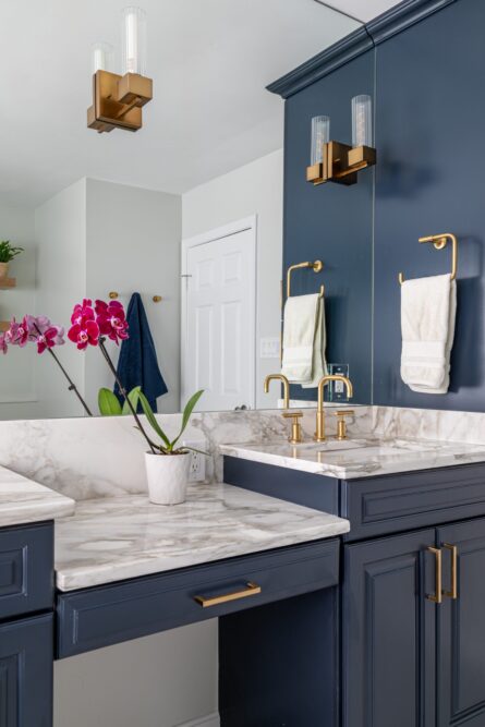 Photo of a bathroom design project featuring ample storage and luxury details