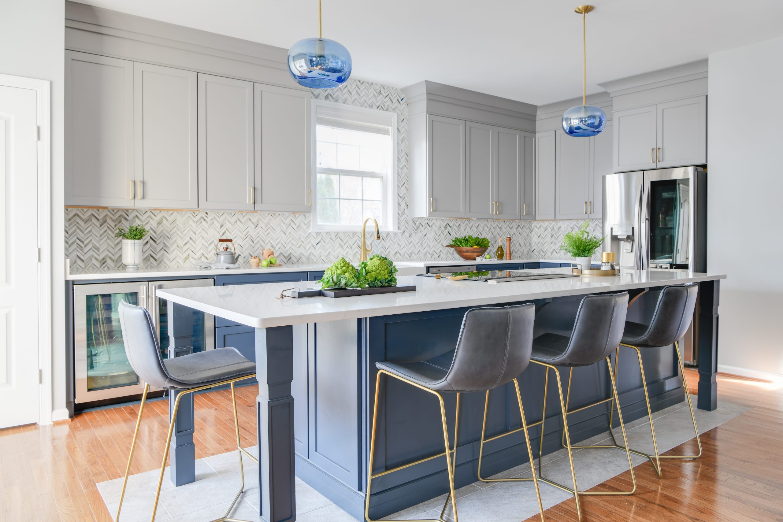 Photo of a kitchen design project in Ashburn VA featuirng a custom island with seating for six