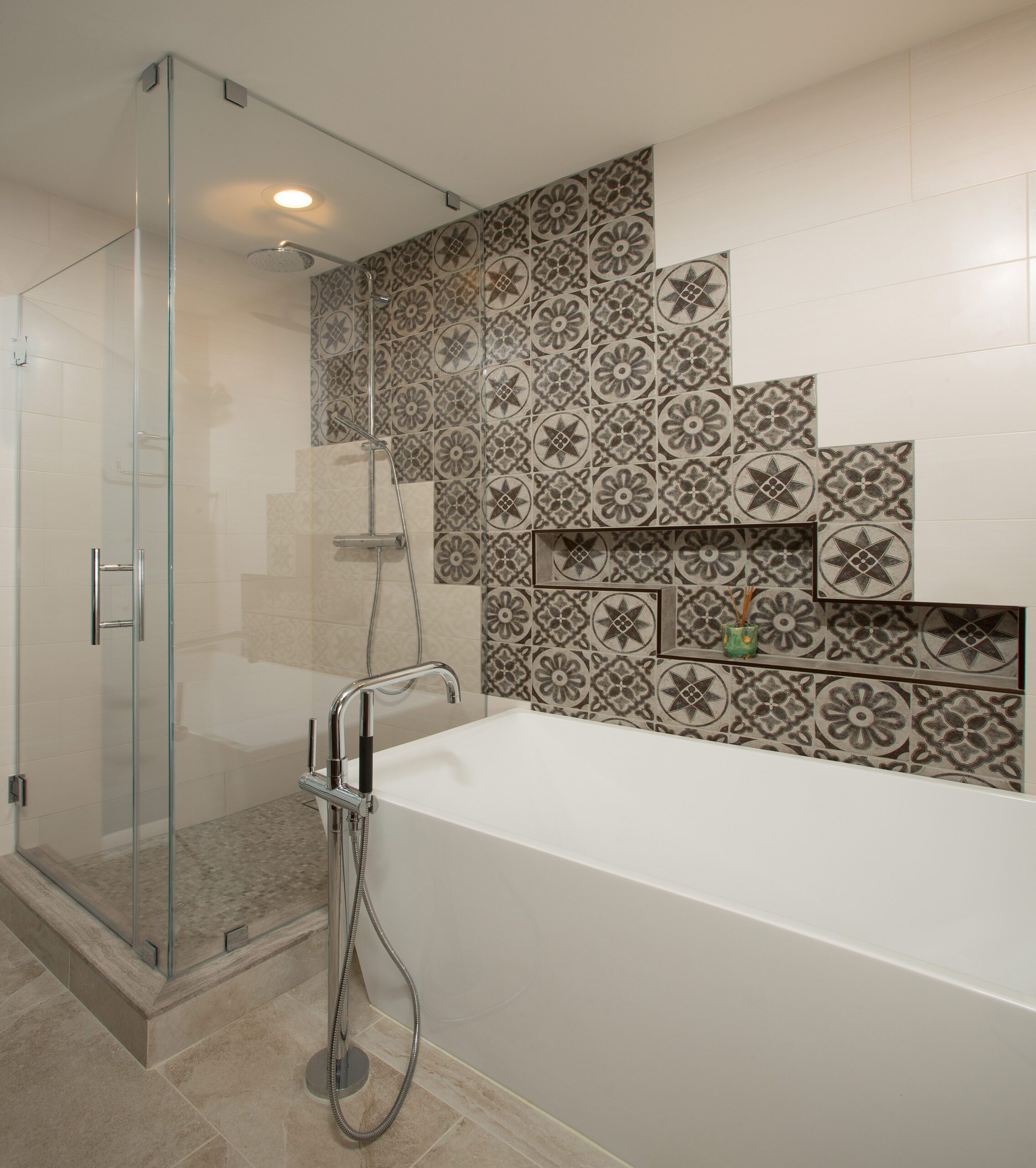 A photo of a European style modern bathroom with custom tile work